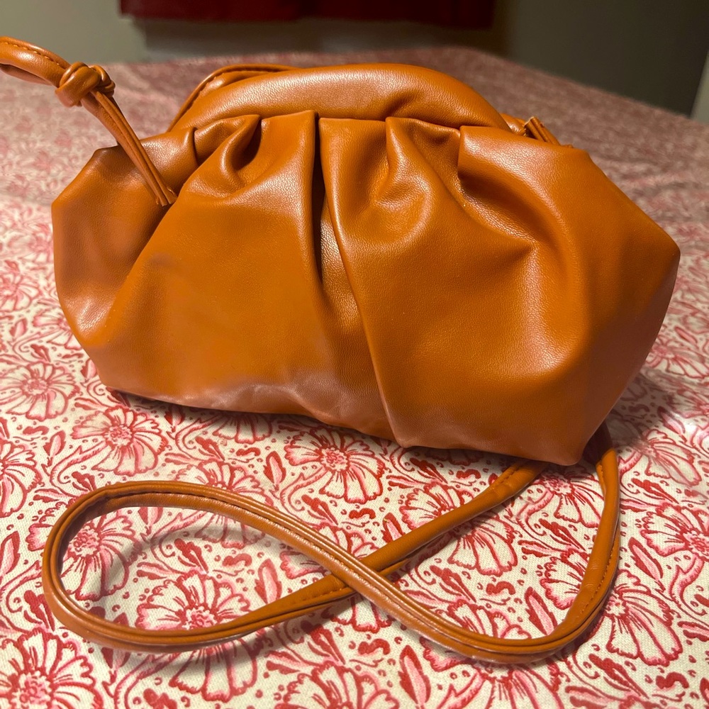 Boutique New without Tag bag with long strap and can be tucked in